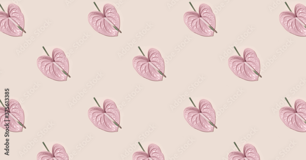 Pink flower in the shape of a heart on pink background.