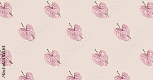 Pink flower in the shape of a heart on pink background.