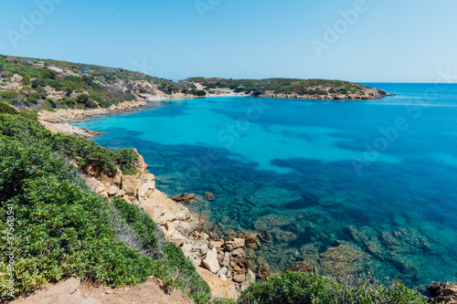 Stunning view of Asinara coastilne bathed by a turquoise and transparent sea with no one in Sardinia  Italy