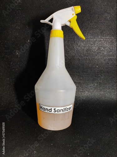 Hand sanitizer bottle isolated on black background