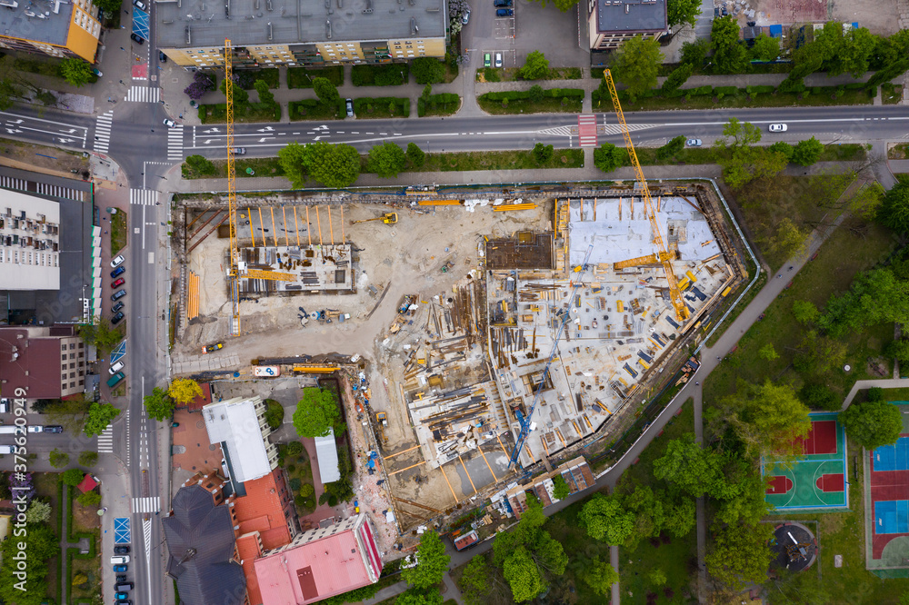 Aerial top view of construction site. Building new apartment buildings in residential area.