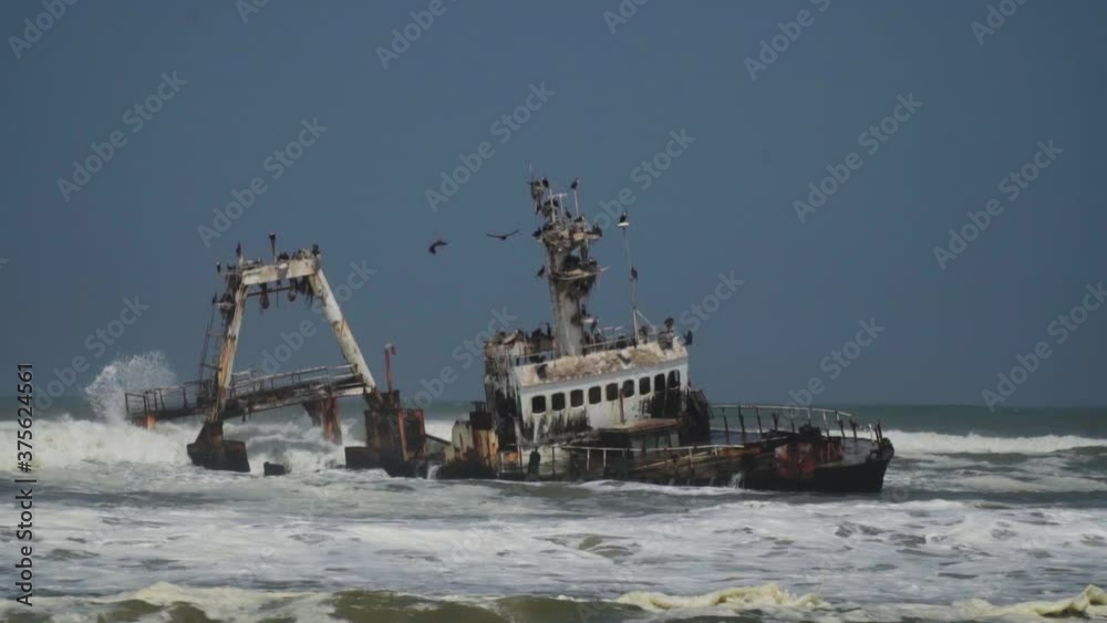 Slow Motion Shot of a Shipwreck and Seagulls off the Skeleton Coast of Namibia, Africa Slow Motion Shot of a Shipwreck and Seagulls off the Skeleton Coast of Namibia, Africa