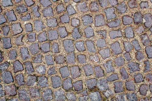 old cobblestone road pavement texture