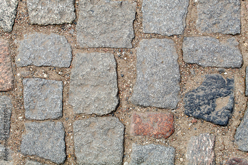 old cobblestone road pavement texture