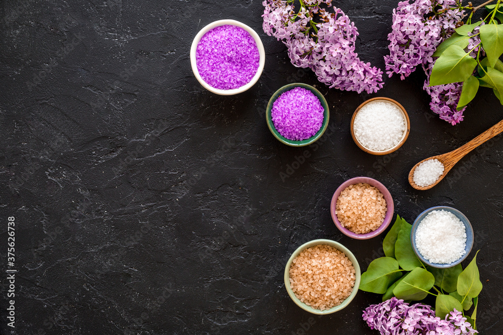 Spa treatment set - sea salt and pink flowers, top view Spa treatment set - sea salt and pink flowers, top view