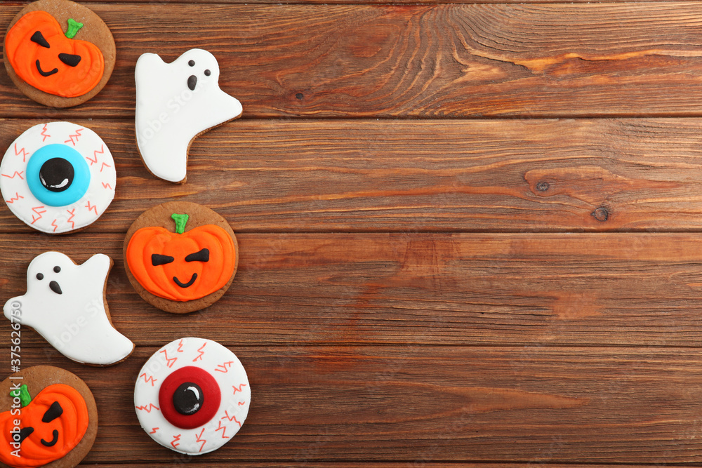 Fototapeta premium Halloween background with gingerbread and other sweets top view with place for text
