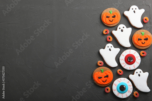 Halloween background with gingerbread and other sweets top view with place for text