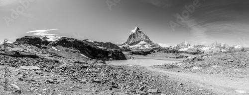 Panorama of Matterhorn mountain as seen from Trockener Steg (summer, with lake and clouds), swiss alps, Switzerland (black and white)