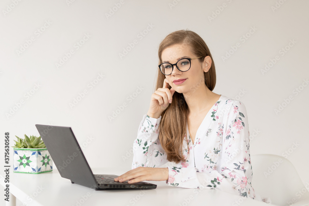 Young woman in glassess studying from home - obrazy, fototapety, plakaty 