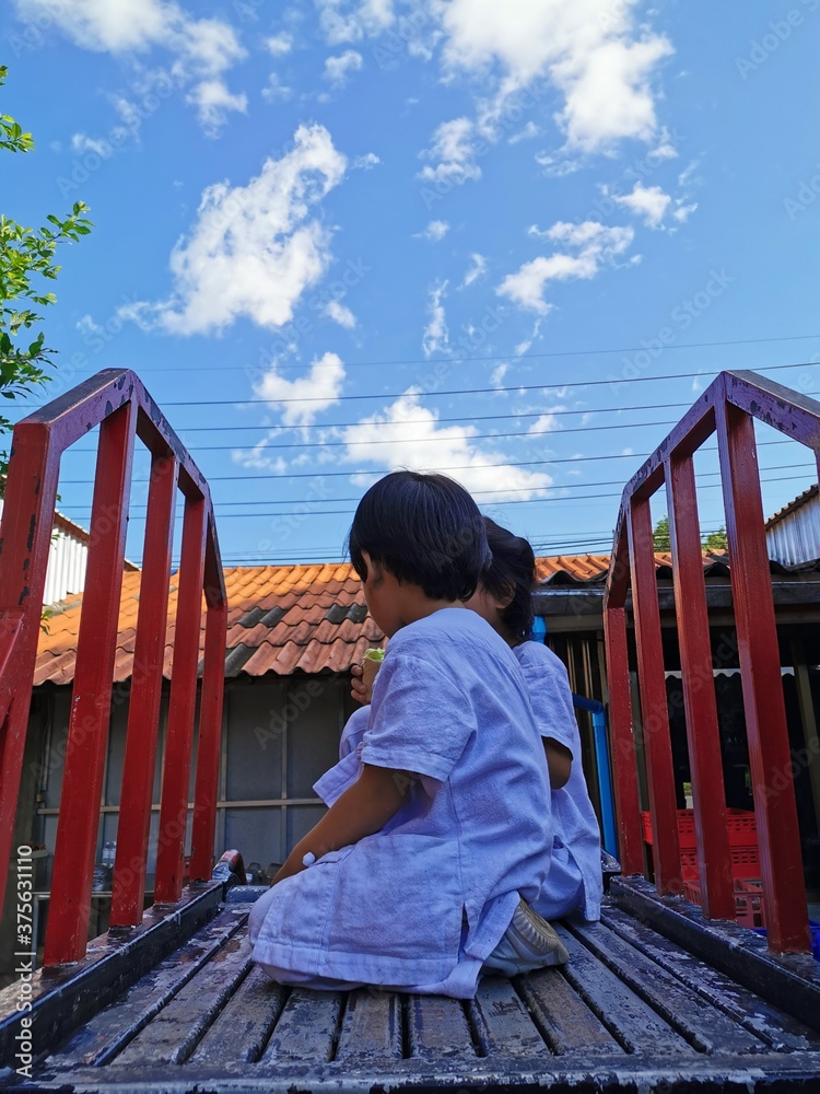 Little boy and girl playing toys together.