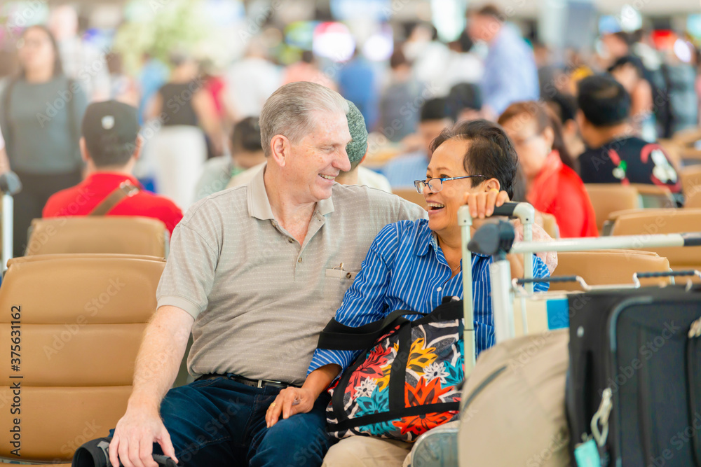 Happy smiling Senior couple in airport. Happy smiling Senior couple in airport.