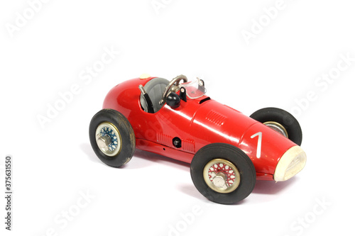 Vintage Classic Toy Tin Racing Car On White background © squeebcreative