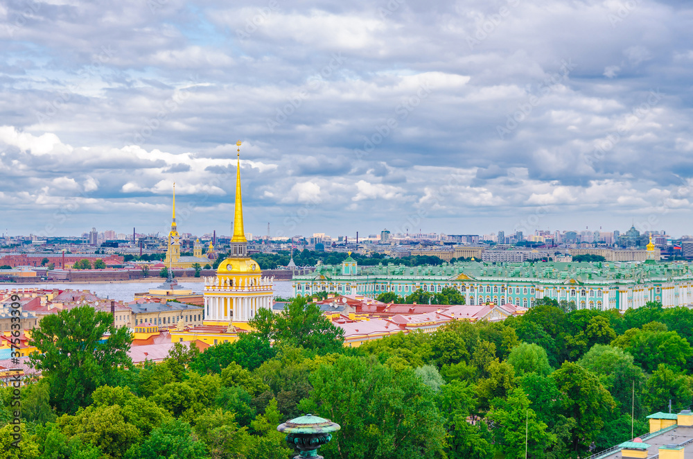 Top aerial panoramic view of Saint Petersburg Leningrad city with Alexander Garden, State Hermitage Museum, Winter Palace, Neva river, golden spire of Admiralty building, blue dramatic sky, Russia