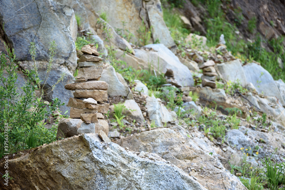 Folded pyramid of different stones in the mountains. Folded pyramid of different stones in the mountains.