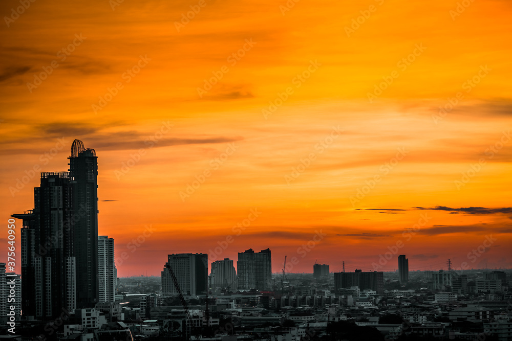 The high angle background of the city view with the secret light of the evening, blurring of night lights, showing the distribution of condominiums, dense homes in the capital community The high angle background of the city view with the secret light of the evening, blurring of night lights, showing the distribution of condominiums, dense homes in the capital community