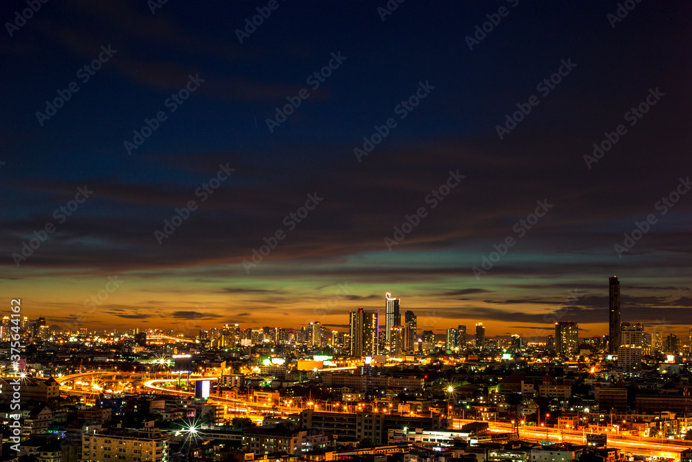 panoramic high-angle evening background of the city view,with natural beauty and blurred sunsets in the evening and the wind blowing all the time,showing the distribution of city center accommodation