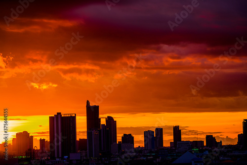 panoramic high-angle evening background of the city view,with natural beauty and blurred sunsets in the evening and the wind blowing all the time,showing the distribution of city center accommodation © bangprik