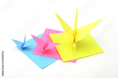 Origami folding crane birds on white