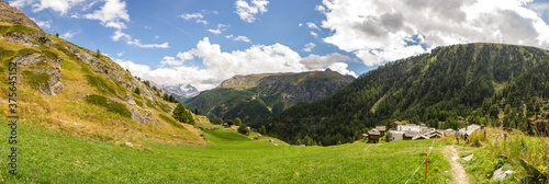 Trail for hikers through landscape of Zermatt, Switzerland (panorama, summer)