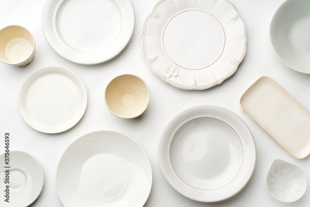 Top view of empty plates on white background Top view of empty plates on white background