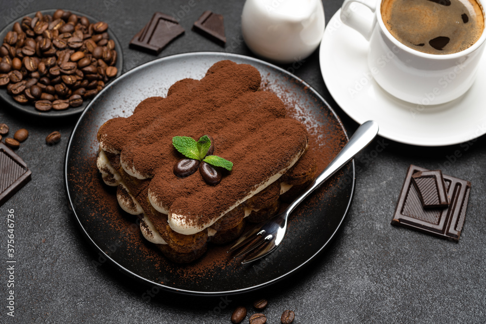 Classic tiramisu dessert, cup of coffee, sugar and milk on concrete background Classic tiramisu dessert, cup of coffee, sugar and milk on concrete background