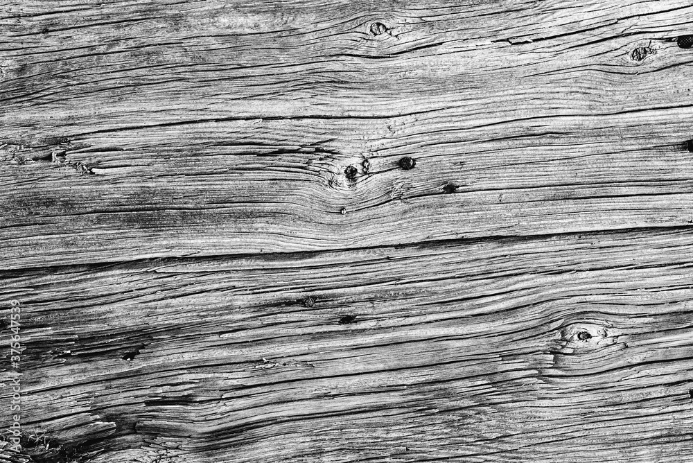 Wooden texture with scratches and cracks. It can be used as a background Wooden texture with scratches and cracks. It can be used as a background