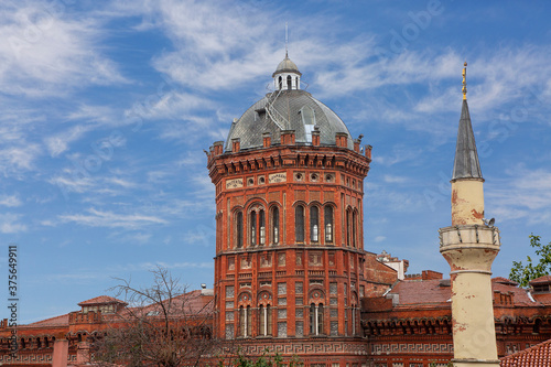 Dome of Fener Greek Orthodox School and minaret, in Fener, Istanbul, Turkey photo