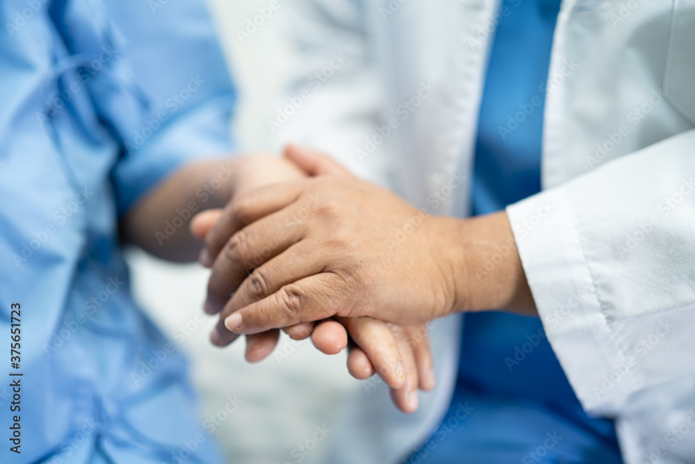 Holding hands Asian senior or elderly old lady woman patient with love, care, encourage and empathy at nursing hospital ward, healthy strong medical concept Holding hands Asian senior or elderly old lady woman patient with love, care, encourage and empathy at nursing hospital ward, healthy strong medical concept