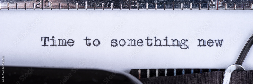 Time to something new - written on a vintage typewriter. Panoramic image