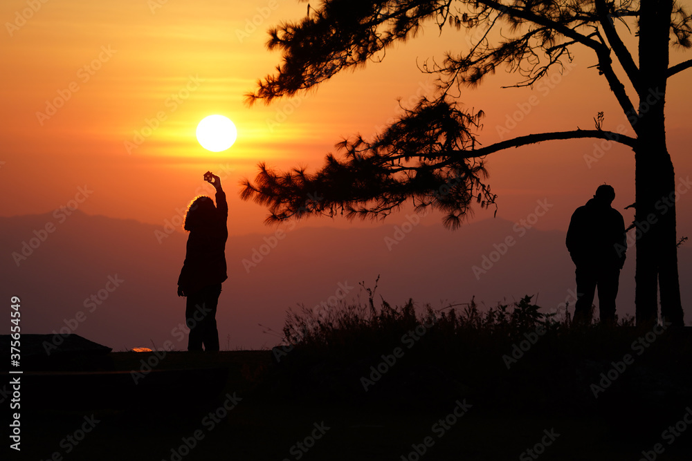 Woman love silhouette in sunset with love.