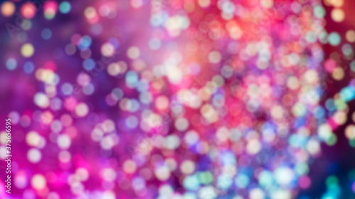 Atmospheric abstract colorful background, city lights at night blur. Background with bokeh defocused lights and shadow