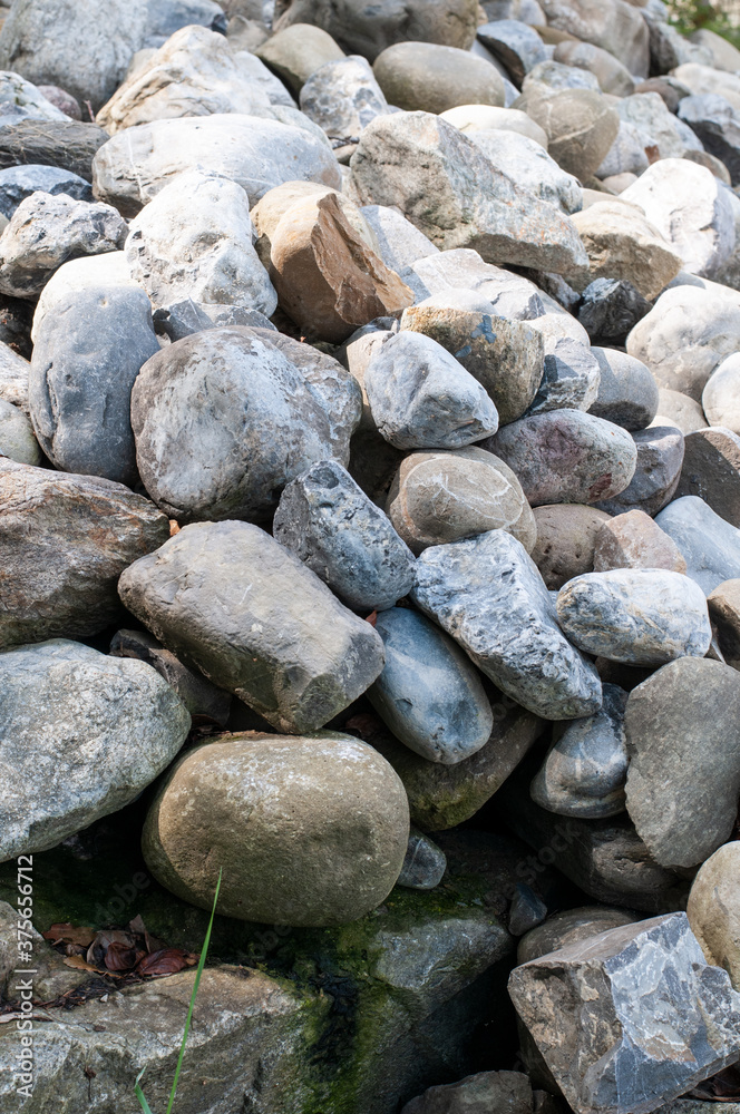 a heap of pebbles on a garden wall a heap of pebbles on a garden wall