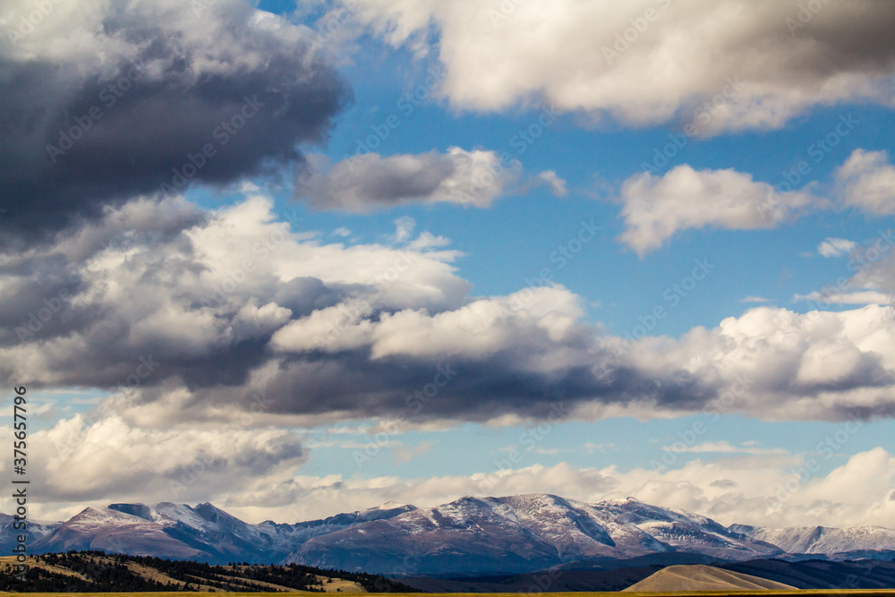 Puffy clouds over mountains, Colorado