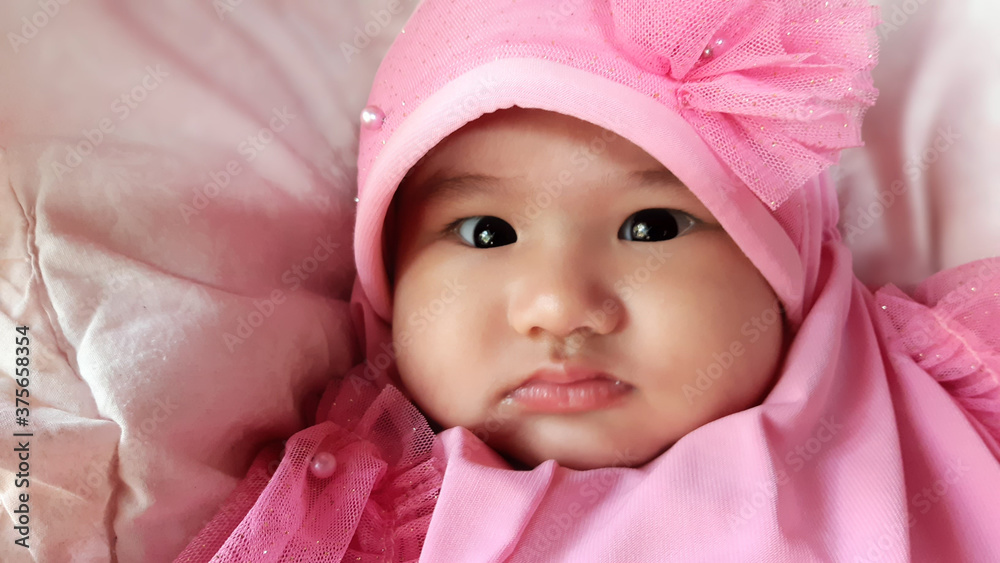 Portrait of little baby girl with pink hijab Portrait of little baby girl with pink hijab