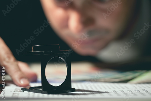 Graphic Designer Checking the Presswork with a Prover photo