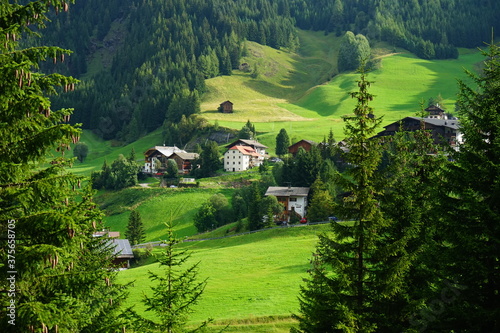 Typical tyrolean houses on the dolomites alps, Sudtirol, Trentino Alto Adige, Italy photo