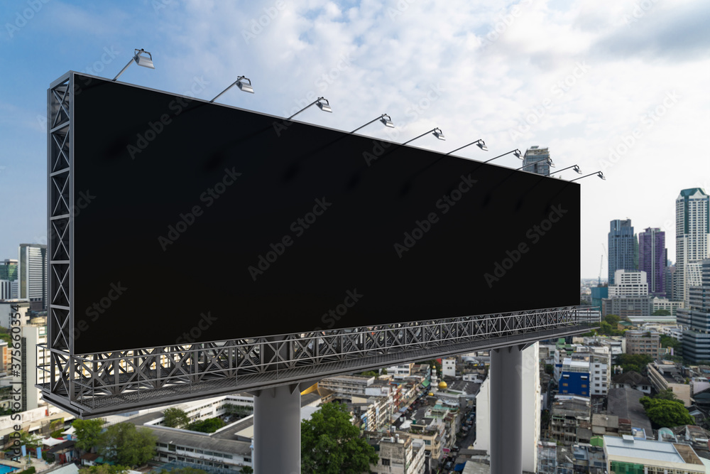 Blank black road billboard with Bangkok cityscape background at day time. Street advertising poster, mock up, 3D rendering. Side view. The concept of marketing communication to promote or sell idea. Blank black road billboard with Bangkok cityscape background at day time. Street advertising poster, mock up, 3D rendering. Side view. The concept of marketing communication to promote or sell idea.
