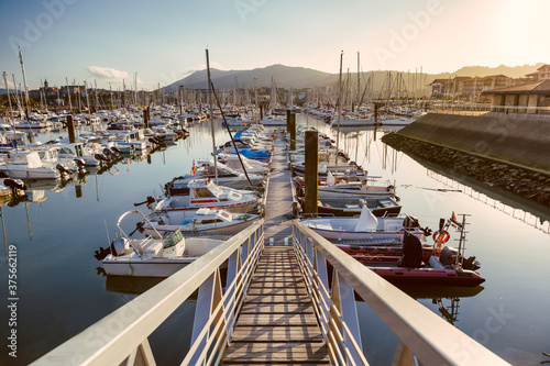 Yachts and boats in Hendaye marina at sunset