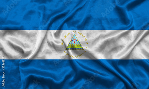 Nicaragua national flag background with fabric texture. Flag of Nicaragua waving in the wind. 3D illustration