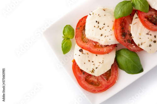 Traditional caprese salad with tomato and mozzarella cheese isolated on white background 