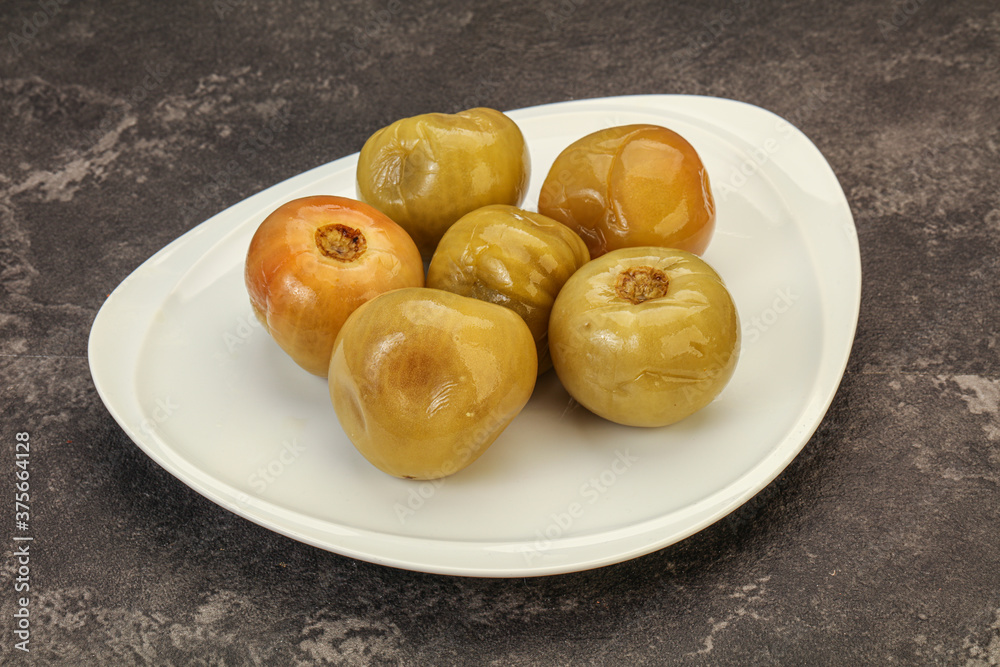 Pickled green tomato in the bowl Pickled green tomato in the bowl