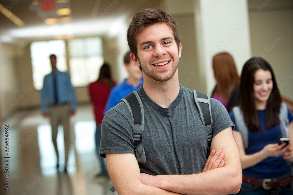 High School: Happy High School Student in Hallway High School: Happy High School Student in Hallway