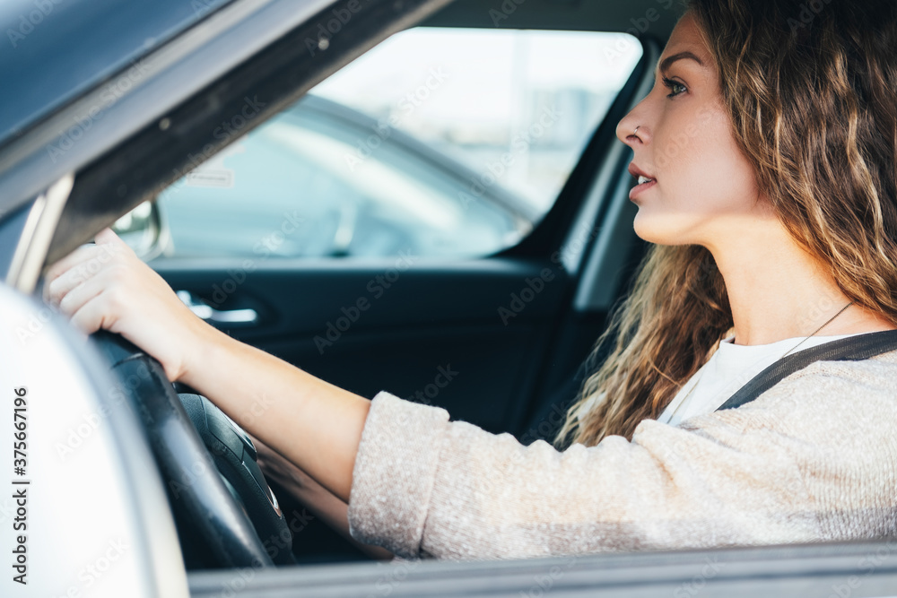 Woman driving her car stock photo