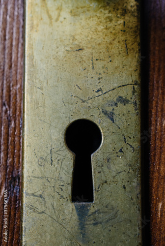 Old brass keyhole on a door