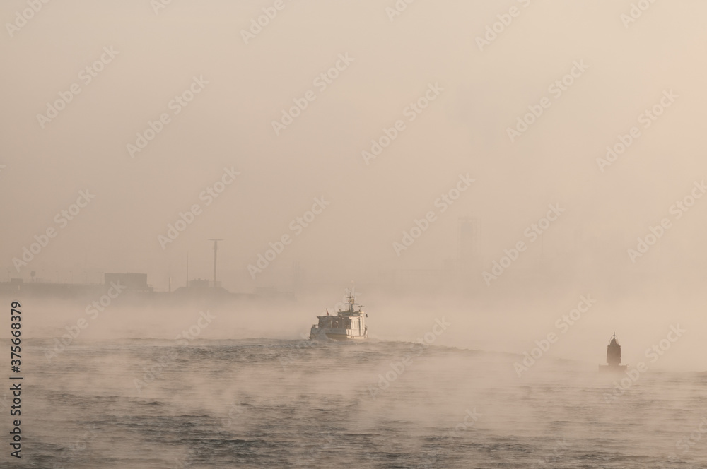 ship in the fog on the river Maas, port of Rotterdam. ship in the fog on the river Maas, port of Rotterdam.
