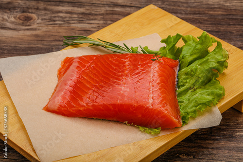 Salmon piece steak served rosemary