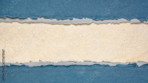 paper abstract in white and blue  with a copy space - sheets of bark and cotton rag paper, blank web banner