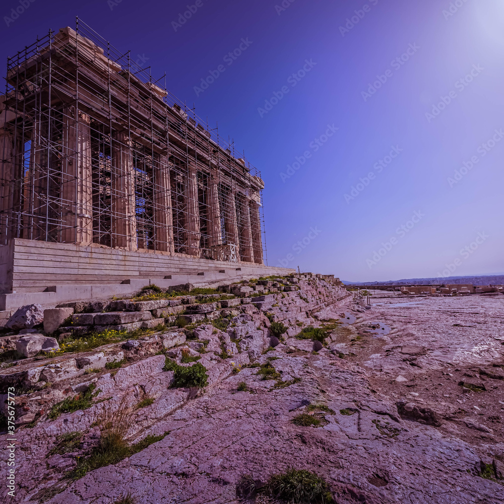 Parthenon ancient temple on acropolis of Athens and crystal clear blue sky, Greece