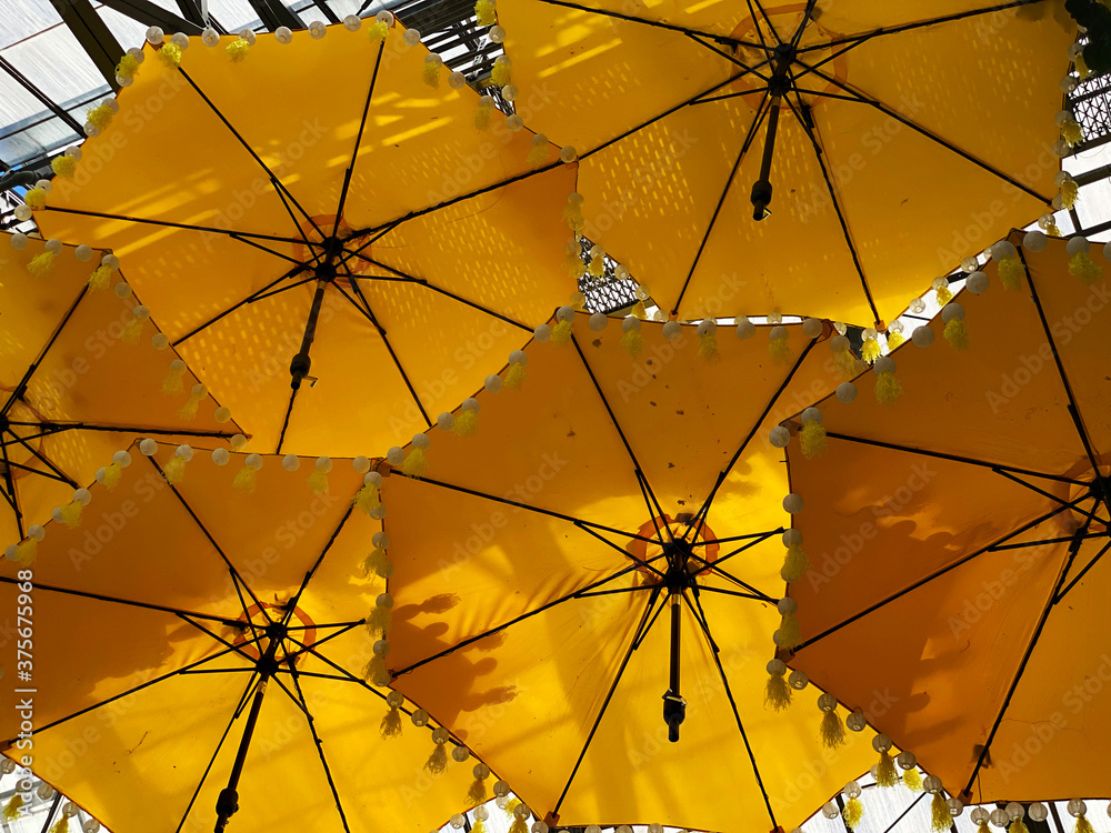 Fototapeta premium yellow umbrella against blue sky