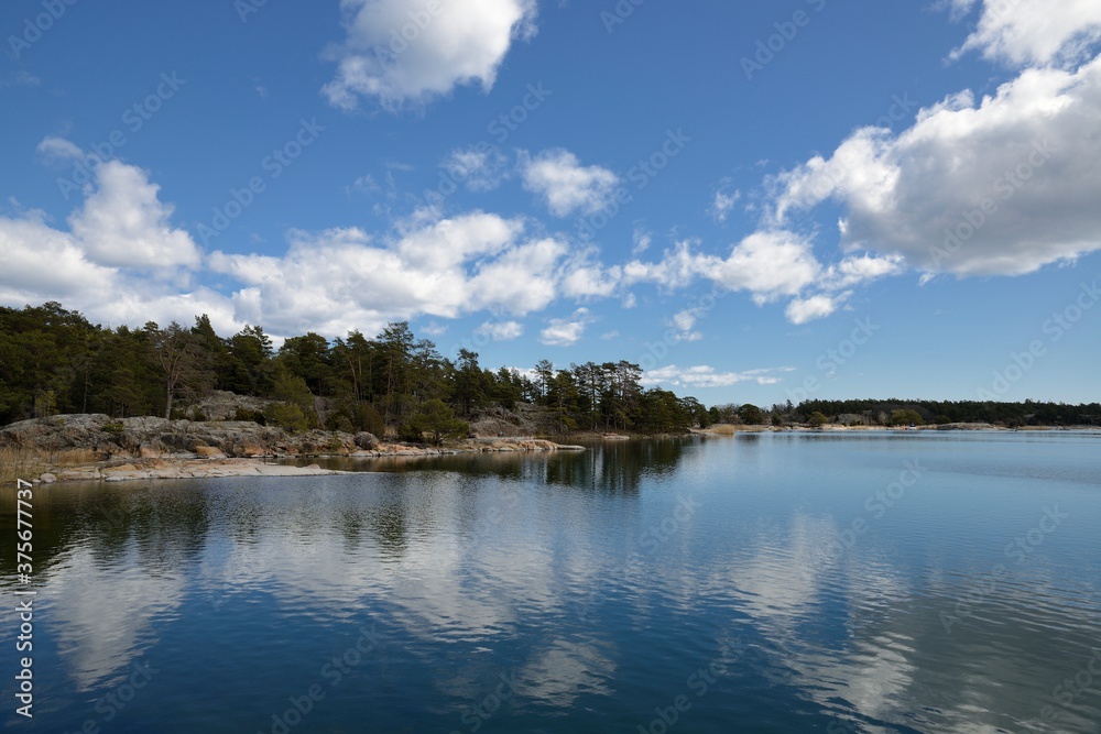 Stendorren in the Swedish archipelago. Calm water with clouds. Stendorren in the Swedish archipelago. Calm water with clouds.